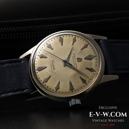 Side view of Vintage Breitling Geneve Cadette Watch 1960s highlighting domed crystal and silver-tone case with blue leather strap.