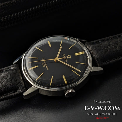 Omega Seamaster 600 1966 Ref. 135011 displayed at an angle, showing black dial, gold hands, and vintage case design on leather strap.