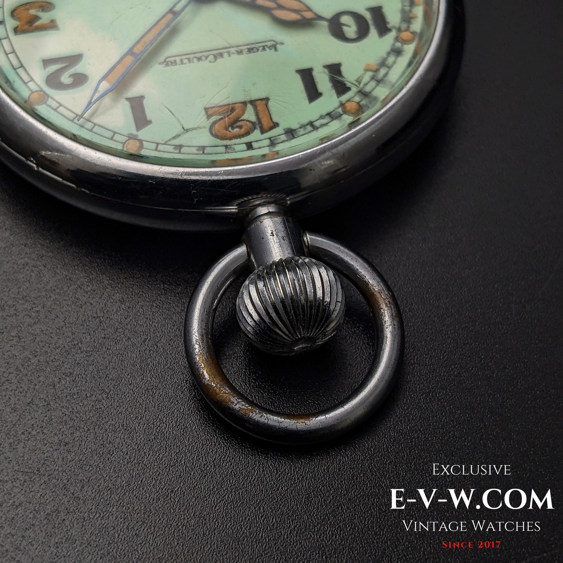 Close-up of the crown and bow of Jaeger-LeCoultre WWII Military Watch Cal. 467 Vintage 1940, showing aged patina and wear.