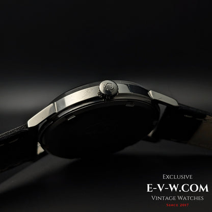 Close-up of Omega crown on the side of Seamaster 600 1966 Ref. 135011, showing polished case and black leather strap connection.