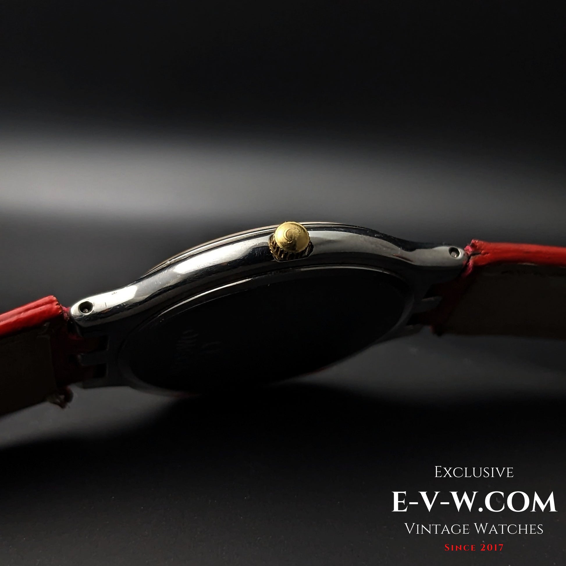 Side profile of Omega vintage watch showing gold crown and slim stainless steel case, Ref. 3961016 Cal. 1436.