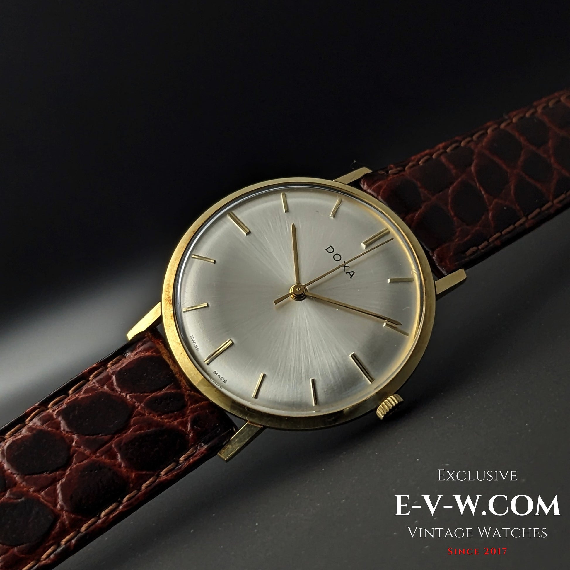 Angled shot of DOXA Vintage 14k Gold Watch 1950 with brown leather strap and minimalist dial, ideal for vintage watch collectors.
