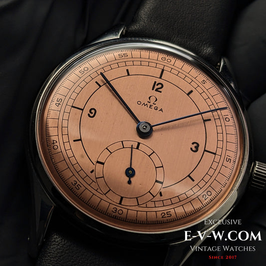 Vintage 1952 Omega Jumbo Ref. 2505 wristwatch with salmon sector dial and Cal. 266 movement. Classic steel case with black leather strap.
