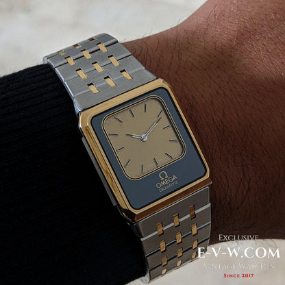 Omega Equinoxe Reverso 1982 vintage watch worn on wrist, showcasing its gold and steel bracelet and minimalist analog dial design.