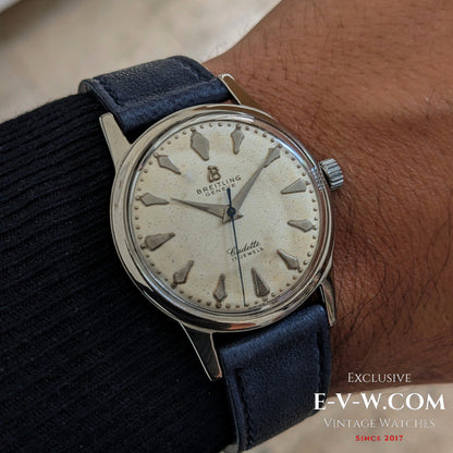 Vintage Breitling Geneve Cadette Watch 1960s worn on wrist, showcasing its classic cream dial and elegant silver case for collectors.