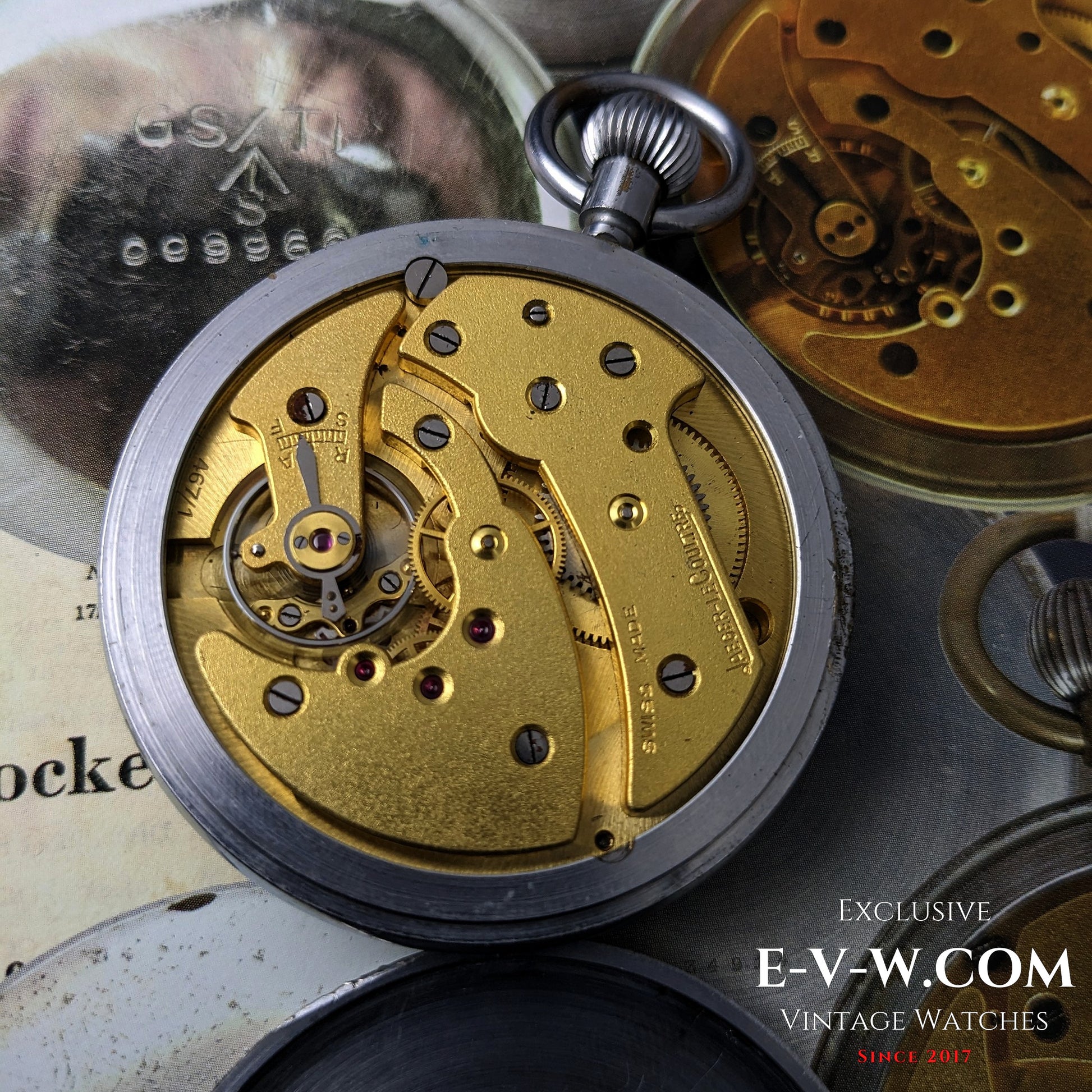 Close-up of Jaeger-LeCoultre WWII Military Watch Cal. 467 Vintage 1940 movement, showcasing gold-toned mechanical components.