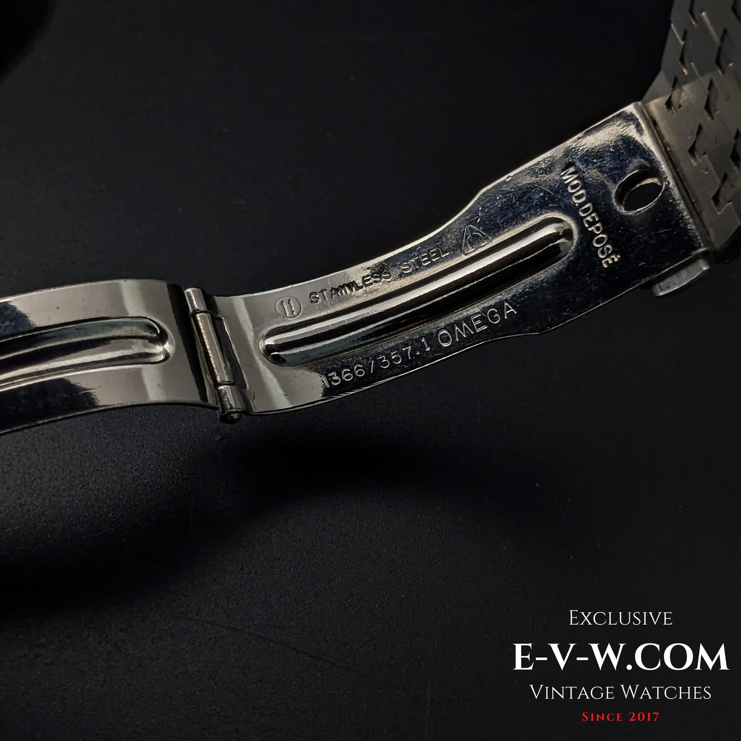 Close-up of Omega Equinoxe Reverso clasp showing stainless steel markings and model reference 1366/7357, emphasizing vintage authenticity.