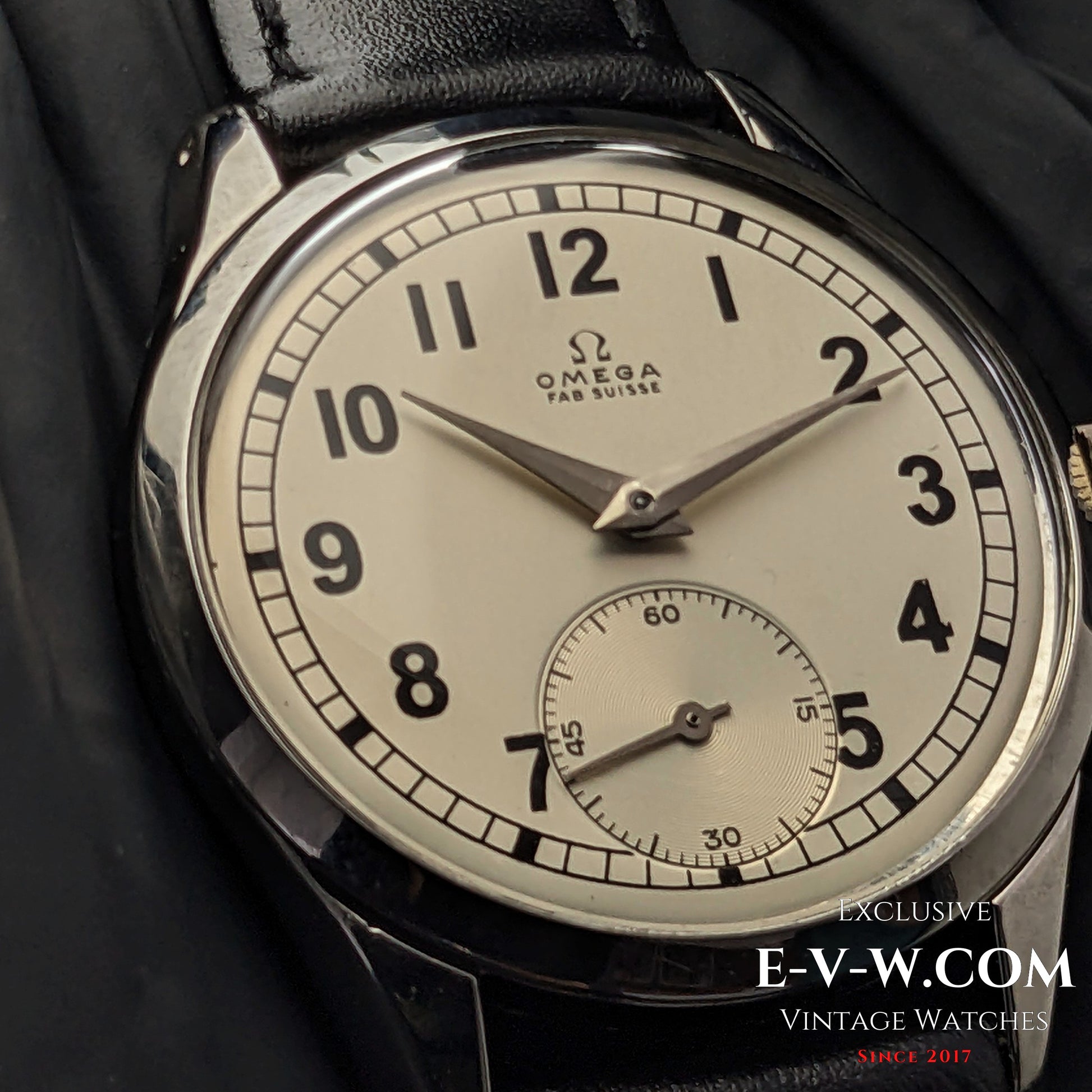 Detailed view of the Omega FAB SUISSE Ref. 2750-6 vintage wristwatch, highlighting its silver dial, black numerals, and subdial at 6 o’clock.