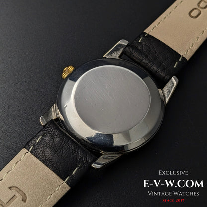 Back case of Omega Seamaster Ref. 2828-9SC Cal. 471 showing polished stainless steel surface and black leather strap.