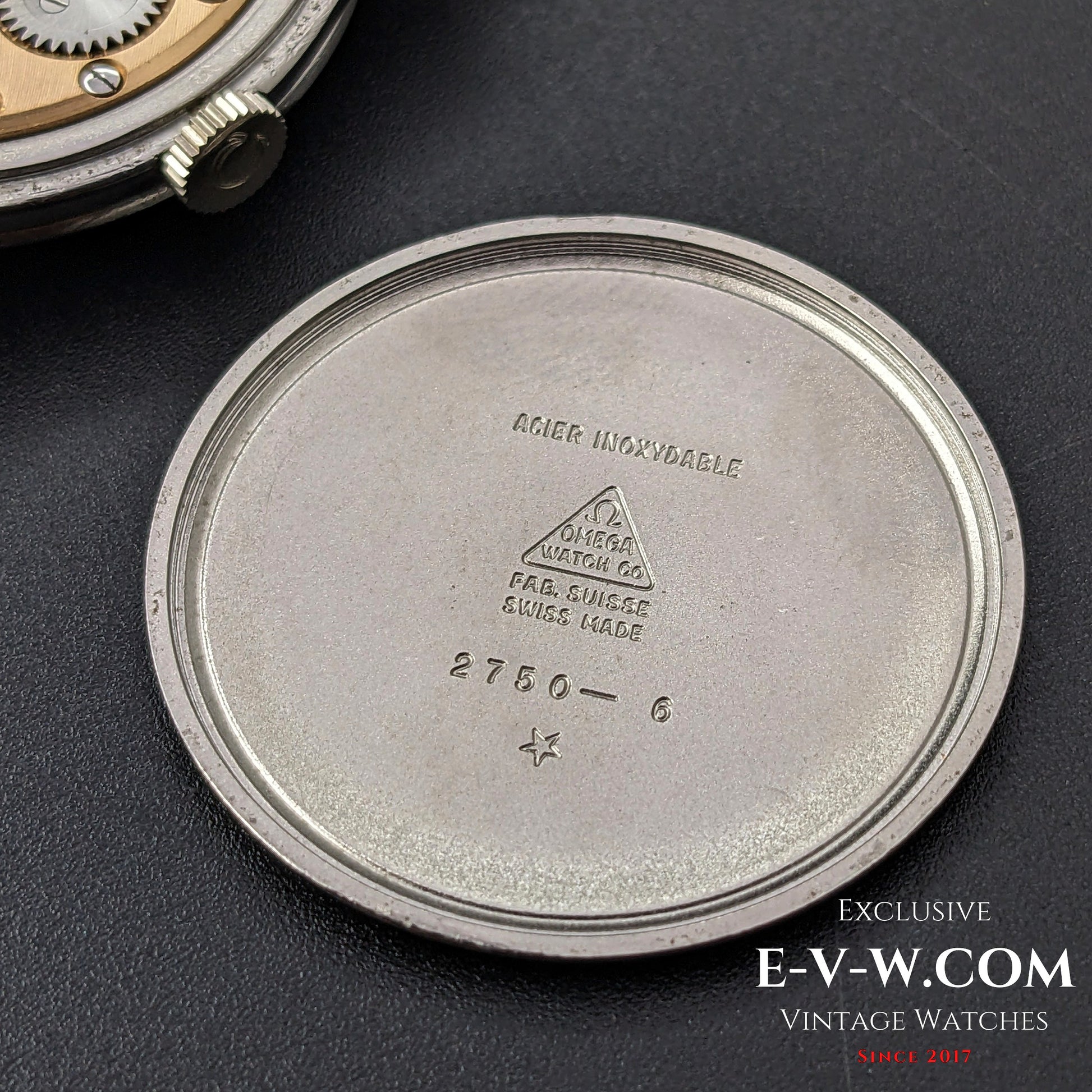 Inside case back of the Omega FAB SUISSE Ref. 2750-6 wristwatch, showing the engraved reference number and Swiss-made markings.