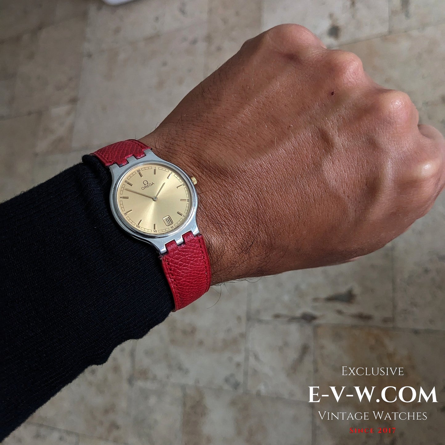 Omega vintage 24-hour dial watch worn on wrist, gold dial and red strap, Ref. 3961016, stylish men's accessory.