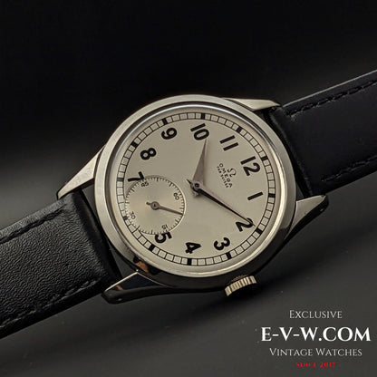 Side view of the Omega FAB SUISSE Ref. 2750-6 vintage wristwatch, showcasing its polished stainless steel case and elegant design.