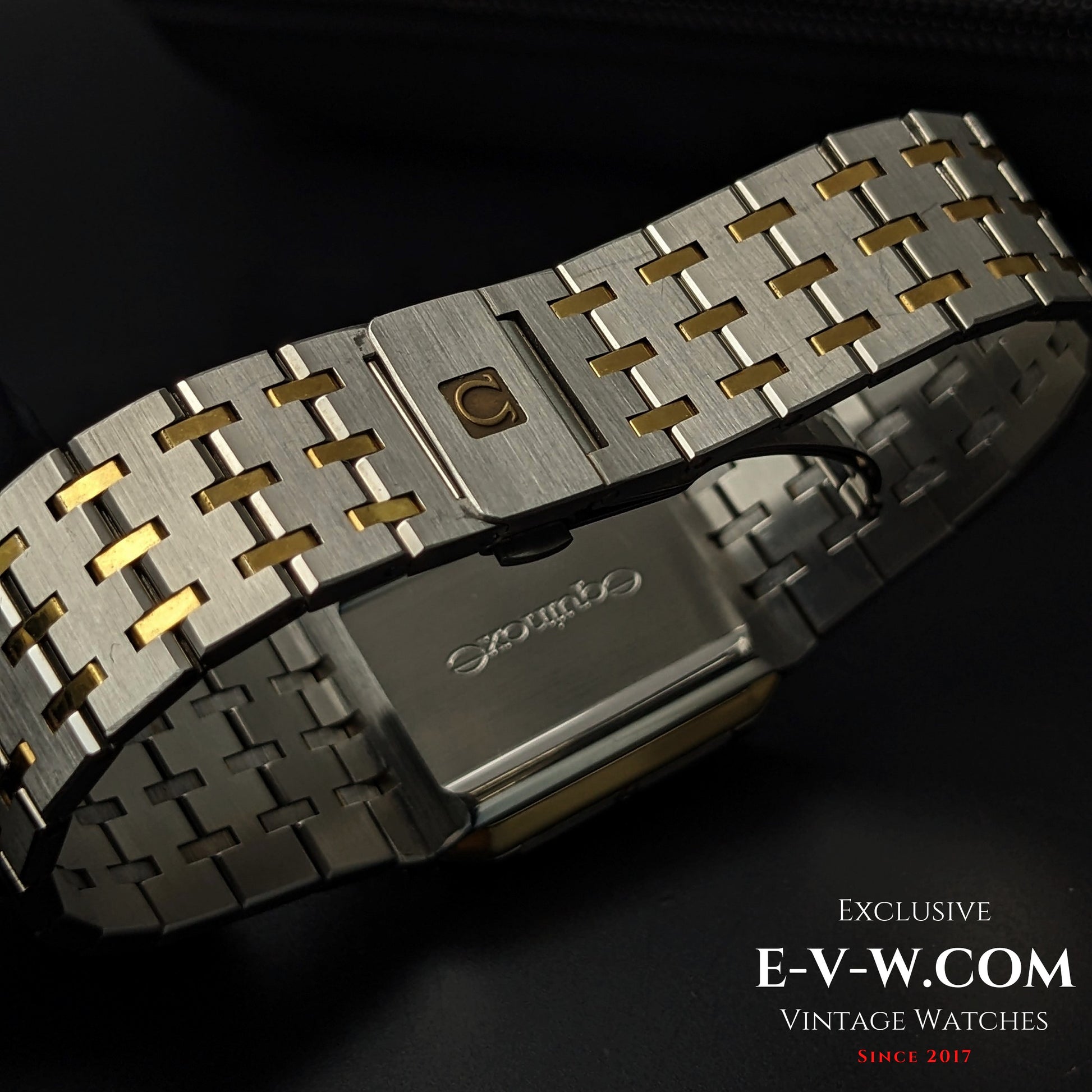 Backside of Omega Equinoxe Reverso 1982 watch bracelet showing two-tone steel and gold links with Omega clasp, showcasing craftsmanship.