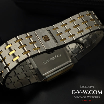 Backside of Omega Equinoxe Reverso 1982 watch bracelet showing two-tone steel and gold links with Omega clasp, showcasing craftsmanship.